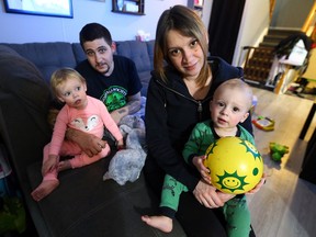 Ed Balsdon holds daughter Rylee and Andrea Gangel holds son Steven in Oshawa on Wednesday, January 18, 2017. (Dave Abel/Toronto Sun)