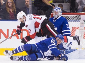 Leafs’ Martin Marincin and Senators’ Derick Brassard collide in front of Frederik Andersen’s net during last night’s game. (STAN BEHAL/Toronto Sun)