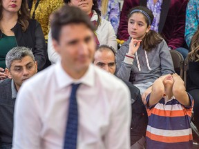 A young boy attends a town hall meeting with Prime Minister Justin Trudeau during a visit to the Cultural Centre in Fredericton on Tuesday, Jan. 17, 2017. (THE CANADIAN PRESS/Andrew Vaughan)