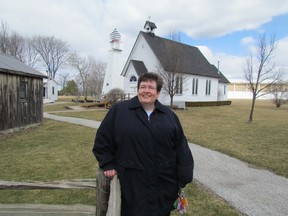 Curator Laurie Mason stands in front of the Trinity St. Clair Chapel on the grounds of the Moore Museum, in Mooretown. The museum has launched a Seasons in St. Clair Canada 150 photo contest, for photographers living in St. Clair Township. File photo/THE OBSERVER