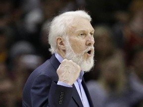 Spurs head coach Gregg Popovich yells to players during first half NBA action against the Cavaliers in Cleveland on Saturday, Jan. 21, 2017. (Tony Dejak/AP Photo)