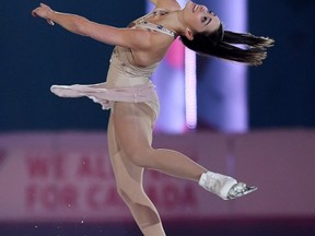 Women’s champion Kaetlyn Osmond performs in the Gala Exhibition to wrap up the Canadian Tire national skating championships in Ottawa yesterday. (The Canadian Press)