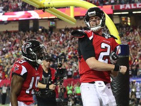 Falcons quarterback Matt Ryan (right) reacts to scoring a touchdown against the Packers during the NFC Championship game in Atlanta on Sunday, Jan. 22, 2017. (Curtis Compton/Atlanta Journal-Constitution via AP)