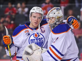 Edmonton Oilers Connor McDavid celebrates goalie Laurent Brossoit's first NHL victory after defeating the Calgary Flames 7-3 at the Scotiabank Saddledome on Jan. 21, 2017. (Getty Images)