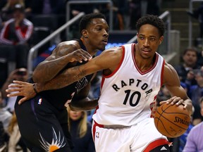 Raptors' DeMar DeRozan drives to the net against the Suns' Eric Bledsoe during NBA action at the Air Canada Centre in Toronto on Sunday, Jan. 22, 2017. (Dave Abel/Toronto Sun)