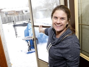 Michelle Rowe at the door to her backyard pool in Bolton. (MICHAEL PEAKE, Toronto Sun)