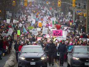 Thousands in Ottawa march down Laurier Avenue in support of the Women's March on Washington.
