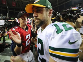 Packers quarterback Aaron Rodgers (right) talks to Falcons quarterback Matt Ryan after the NFC Championship game in Atlanta on Sunday, Jan. 22, 2017. (Curtis Compton/Atlanta Journal-Constitution via AP)