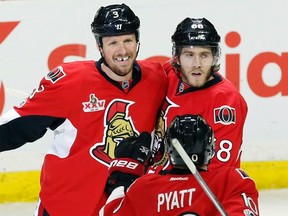 Senators’ Mike Hoffman (right) celebrates one of his two goals against the Columbus Blue Jackets yesterday. (THE CANADIAN PRESS)