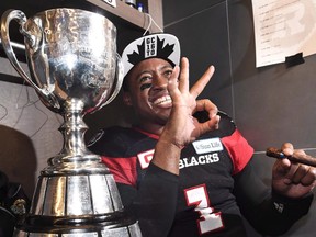 Ottawa Redblacks quarterback Henry Burris (1) and 10-year-old son, Armand, celebrate the Redblacks Grey Cup win over the Calgary Stampeders in Toronto on Sunday, November 27, 2016. Veteran CFL quarterback Burris is retiring. THE CANADIAN PRESS/Frank Gunn