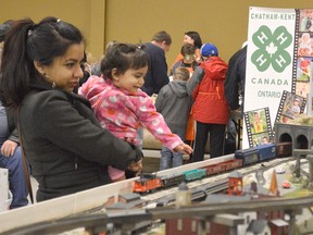 Mehrin Haque holds her daughter Imaani at the CK Toy Show and Sale, held at the John D. Bradley Centre Jan. 15. It's the first time Haque and her family have been to the event.