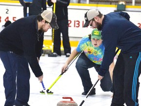 During the Mitchell Curling Club Bonspiel at the Mitchell & District Arena Jan. 21, Taylor Jantzi threw his rock toward the house as his teammates, Mike Tracy (left) and Steve Thedorff (right) prepared to sweep a path to success. The bonspiel’s two draws were based on points and combining them together the results are as follows: 1st, the team of Jess Klumper, Karen Klumper, Terry Klumper and Jeremy Klumper; 2nd, Bob Harris, Dave Eidt, Murray Gordner and Kathy Bennewies; and 3rd, Mark Taylor, Kevin Quipp, Frank Harmer and Rich Templeman. GALEN SIMMONS MITCHELL ADVOCATE