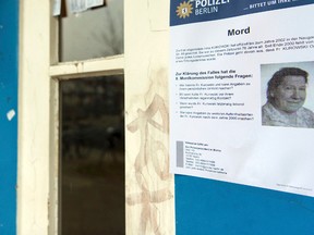 A police poster with a photo of Irma Kurowski, is photographed at the entrance of an apartment building in Berlin, Monday, Jan. 23, 2017. (Monika Skolimowska/dpa via AP)