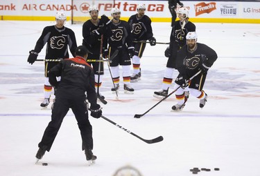 Calgary Flames  Deryk Engelland goes through some drills in the pre-game skate before their game with the Toronto Maple Leafs in Toronto on Monday January 23, 2017. Jack Boland/Toronto Sun/Postmedia Network