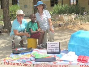 Ashfield Township residents Suzanne Andrew and Anne Andrew are shown with one of the recipients of 5,000 bed kits delivered during Sleeping Children Around the World’s 2015 Tanzania distribution. This particular bed kit was donated in memory of Peter Van Diepenbeek (Anne’s brother), by Suzanne and her husband Bill. (submitted photo)