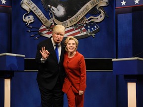 In a Saturday, Oct. 1, 2016 file photo provided by NBC, Alec Baldwin, left, as Republican presidential candidate, Donald Trump, and Kate McKinnon, as Democratic presidential candidate, Hillary Clinton, perform on the 42nd season of "Saturday Night Live," in New York. Republican presidential candidate Donald Trump tweeted early Sunday morning, Oct. 16, 2016, that the show’s skit depicting him this week was a “hit job.” (Will Heath/NBC via AP, File)