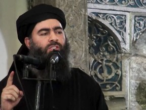 This file image made from video posted on a militant website July 5, 2014, purports to show the leader of the Islamic State group, Abu Bakr al-Baghdadi, delivering a sermon at a mosque in Iraq during his first public appearance. Reports suggest the ISIS leader has been “critically injured” in a U.S. airstrike in northern Iraq. (AP Photo/Militant video)