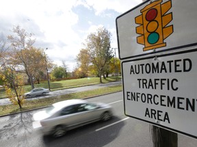 At next week's finance meeting, council will consider installing red light cameras at six city intersections. The program would cost the municipality about $500,000 per year. (Postmedia file photo)