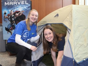 Kathleen Waterston, left, and Emily Robertson set up camp for the week in Joseph S. Stauffer Library at Queen's University in Kingston for the Live-In For Literacy event. (Charlie Pinkerton/For The Whig-Standard)