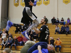 Local dunking sensation Chase Kilganon performs during halftime at an OCAA women's basketball game featuring Cambrian College and Sault College at the Cambrian College gym in Sudbury, Ont. on Saturday January 21, 2017. John Lappa/Sudbury Star/Postmedia Network