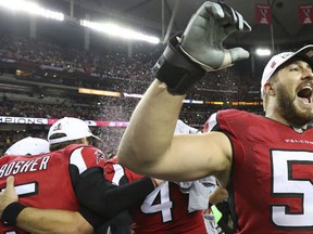 Atlanta Falcons' Alex Mack celebrates defeating the Green Bay Packers 44-21 in the NFL football NFC Championship game to advance to the Super Bowl, Sunday, Jan. 22, 2017, in Atlanta. (Curtis Compton/Atlanta Journal-Constitution via AP)