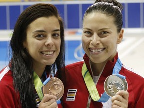 Canadian divers Meaghan Benefito (l) won a bronze medal and Roseline Filion won a silver in the women's 10m platform diving the at the Pan Am Aquatic Centre in Toronto on Saturday July 11, 2015. (Michael Peake/Toronto Sun/Postmedia Network)