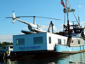 This 2014 photo shows the Wild Alaskan, a converted crabbing boat that had been used as a strip club, moored near downtown Kodiak, Alaska. A sentencing hearing has been rescheduled for Darren Byler, who was found guilty of illegally dumping human waste into a harbor from the boat. Byler had been scheduled for sentencing in Anchorage Thursday, Jan. 19, 2016, but his attorney, John Cashion, said Byler's flight from Kodiak Island was delayed and the sentencing is now set for Friday. (Kodiak Daily Mirror via AP)