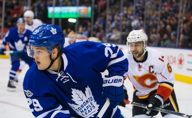 Toronto Maple Leafs William Nylander during 1st period action against the Calgary Flames Mark Giordano at the Air Canada Centre in Toronto, Ont. on Monday January 23, 2017. Ernest Doroszuk/Toronto Sun/Postmedia Network