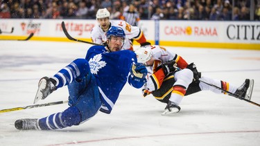 Toronto Maple Leafs Frederik Gauthier during 2nd period action against Calgary Flames Matt Stajan at the Air Canada Centre in Toronto, Ont. on Monday January 23, 2017. Ernest Doroszuk/Toronto Sun/Postmedia Network