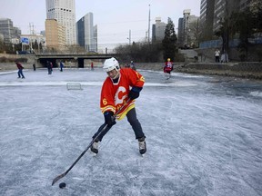 A man practises ice hockey on a frozen river in Beijing on Jan. 18, 2017. The sport is growing throughout Asia. (GETTY IMAGES)