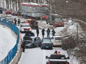 Up to half a dozen cars were involved in a crash on Colonel By Drive Tuesday. WAYNE CUDDINGTON / POSTMEDIA