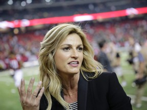 In this Oct. 30, 2016, file photo, Fox Sports broadcaster Erin Andrews, left, speaks with Atlanta Falcons wide receiver Julio Jones after the second of an NFL football game against the Green Bay Packers in Atlanta. (AP Photo/David Goldman, File)