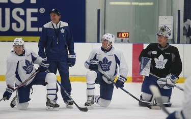 Toronto Maple Leafs Zach Hyman (11) coach Mike Babcock, Auston Matthews (34) and Frederik Andersen (R) are a happy bunch at practice as they prepare for their game Wednesday night in Detroit in Toronto on Tuesday January 24, 2017. Jack Boland/Toronto Sun/Postmedia Network