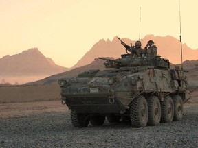 A Canadian LAV (light armoured vehicle) arrives to escort a convoy in Afghanistan on Nov.26, 2006. Canada won't revisit a controversial decision to allow the sale of light armoured vehicles to Saudi Arabia. (THE CANADIAN PRESS/Bill Graveland)