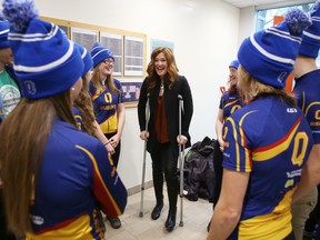 Canadian Olympic cyclist and speed skater Clara Hughes talks with members of the Queen's University cycling team before the start of the ceremony where $1 million was donated to the university for mental health research in Kingston, Ont. on Tuesday, Jan. 24, 2017. 
Elliot Ferguson/The Whig-Standard/Postmedia Network