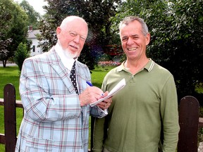 Don Cherry, left, turns the tables on Whig-Standard journalist Patrick Kennedy by interviewing him during a visit to Wolfe Island on July 12, 2013. (Ian MacAlpine/The Whig-Standard)