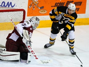 Petes goalie Scott Smith stops Kingston Frontenacs' Jason Robertson during OHL action on Jan. 14 at the Memorial Centre in Peterborough. (Clifford Skarstedt/Postmedia Network)