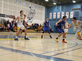 Ryan McLaren (8) and Brett Jakubec (5) show the effort that helped them become the leading scorers on the Concordia Thunder basketball team that has won 12 in a row. Here, they face the King’s University College Eagles, who split a four-game series last year and dropped a pair of November meetings this season. Difficult back-to-back games are likely this weekend as ACAC squads zero in on playoff positions – and not just in basketball. (Submitted)