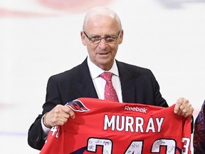 Sens senior hockey adviser Bryan Murray was given a Capitals jersey signed by the team during last night’s Ring of Honour ceremony. Murray won 343 games as coach of the Caps. (THE CANADIAN PRESS)
