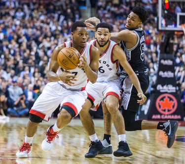 Toronto Raptors Kyle Lowry (front) and Cory Joseph during 2nd half action against San Antonio Spurs Dejounte Murray at the Air Canada Centre in Toronto, Ont. on Tuesday January 24, 2017. Ernest Doroszuk/Toronto Sun/Postmedia Network