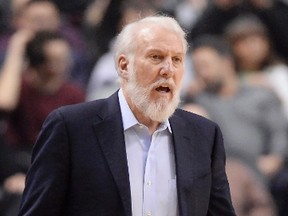 Spurs coach Gregg Popovich watches the action at the Air Canada Centre on Tuesday night. (Frank Gunn/The Canadian Press)