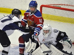 Edmonton Oil Kings' Tyson Gruninger gets pushed by Swift Current Broncos' Tyler Steenbergen during pre-season action at Servus Place in St. Albert, Aug. 30, 2014. (File)