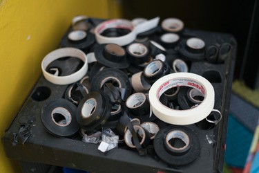 In this Jan. 11, 2017 photo, rolls of electrical tape used to create custom bikinis, which offer crisp tan lines, sit at the Erika Bronze rooftop salon in the suburb of Realengo in Rio de Janeiro, Brazil. While pulling it off would normally hurt, temperatures close to 100 degrees Fahrenheit (40 Celsius) ensure plenty of sweat and a smooth removal. (AP Photo/Renata Brito)