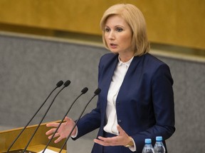 Russian lawmaker Olga Batalina addresses the State Duma (lower parliament house) in Moscow, Russia, Wednesday, Jan. 25, 2017. The State Duma voted overwhelmingly Wednesday to eliminate criminal liability for battery on family members that does not cause bodily harm. The bill that makes battery on a family member punishable by a fine or a 15-day day arrest has yet to be approved in the third reading. (AP Photo/Alexander Zemlianichenko)