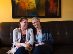 Melissa Benoit (left) who has cystic fibrosis, and her mother Sue Dupuis, share a happy moment at her home in Burlington on Friday, Jan. 20, 2017. Benoit was dying from a severe lung infection that had spread into her blood and put her into organ failure.To save her life, and in what they believe is a world first, Toronto General Hospital doctors removed her lungs. (THE CANADIAN PRESS/PHOTO)