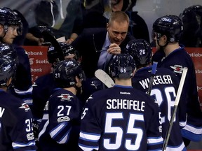 Winnipeg Jets head coach Paul Maurice speaks to his team during a video review as the team played against the San Jose Sharks during third period NHL hockey action in Winnipeg, Tuesday, January 24, 2017.