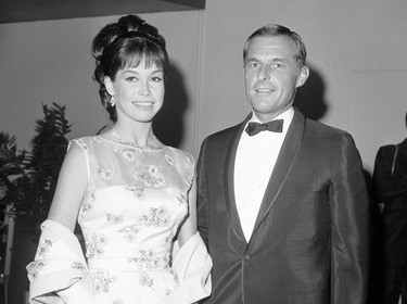 This May 22, 1966 file photo shows actress Mary Tyler Moore and her husband Grant Tinker at the Emmy Awards in Los Angeles. Moore died Wednesday, Jan. 25, 2017, at age 80. (AP Photo/David Smith, File)