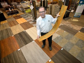 Al Sinclair stands on a floor showing the many patterns of Vinyl plank flooring at Alfred's Carpet One. They will be displaying the flooring at the Lifestyles Home Show which runs Friday to Sunday at Western Fair District. (MORRIS LAMONT, The London Free Press)