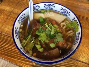 Braised beef soup with hand-pulled noodles at La Noodle.  (Peter Hum, Postmedia)