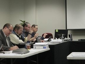 Woodlands County Council discussed ways to cut costs and balance a large deficit during a special budget meeting on Jan. 17. From left to right: Chief administrative officer Luc Mercier and councillors Dale McQueen, Chad Merrifield and Dale Kluin. (Joseph Quigley | Whitecourt Star).